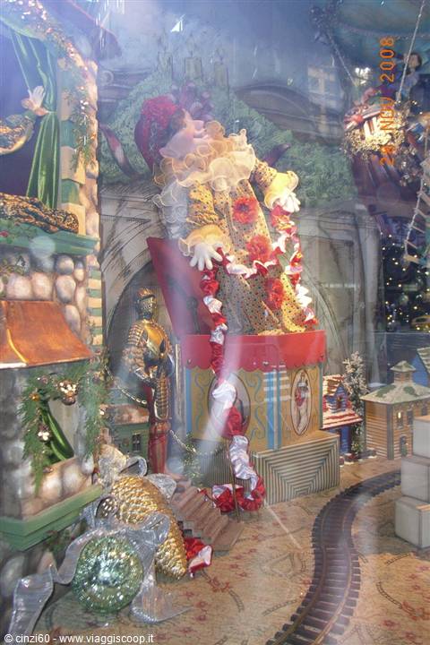 Giant Santa clown emerging from a gift box, Christmas window display