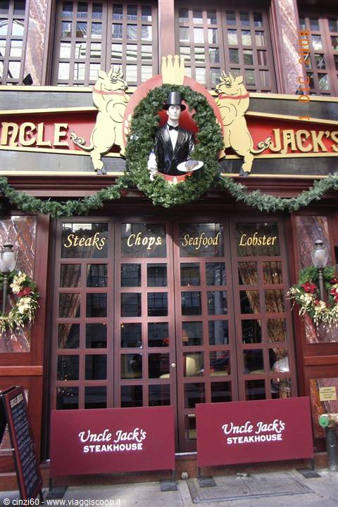 Uncle Jack's Steakhouse sign with waiter figure and Christmas garlands