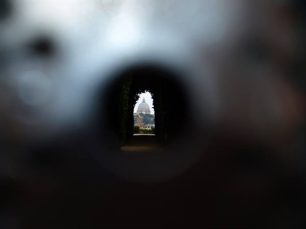 St. Peter's dome framed through the Aventine keyhole in Rome