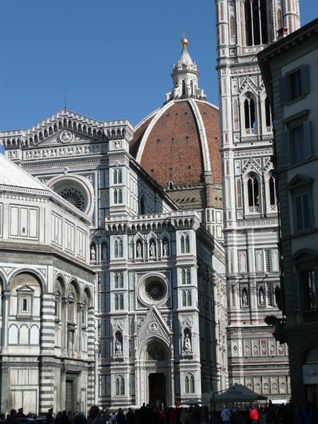 The marble facade of Florence Cathedral with Brunelleschi's dome and Giotto's bell tower