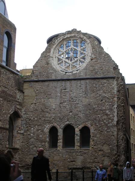 Winchester Palace ruin in London, stone rose window above three blind arches