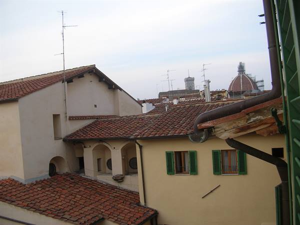 Terracotta rooftops in Florence, Brunelleschi's dome in the background