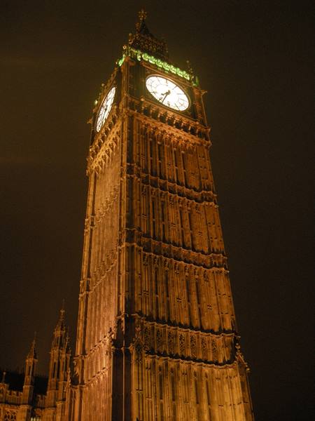 Big Ben lit up at night, glowing clock on the Victorian tower in London