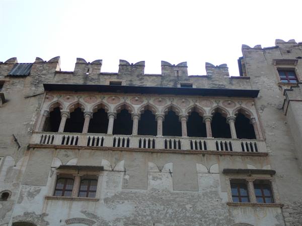 Gothic loggia with marble columns on Trento palace, daylight