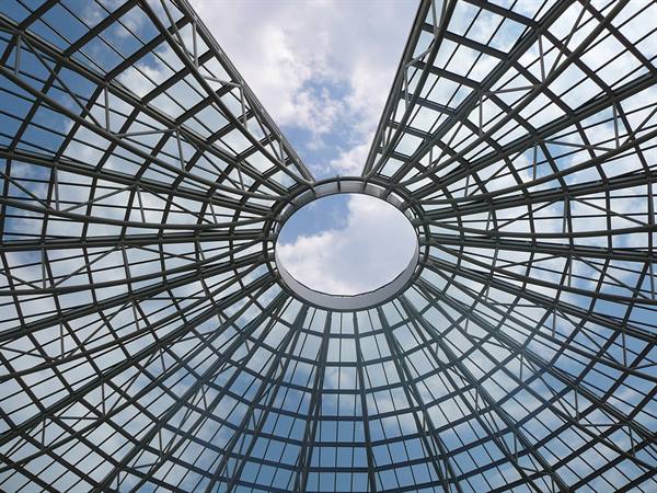 Glass and steel dome with central oculus open to the clouds