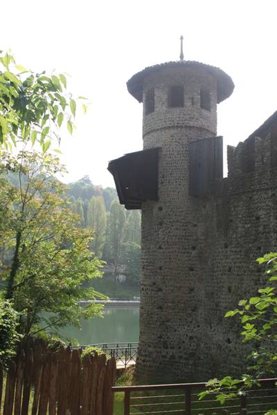 Stone crenellated tower of Borgo Medievale by the Po river, Turin