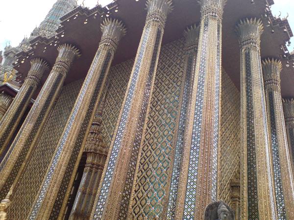 Columns covered in golden mirror mosaics at Wat Phra Kaew, Bangkok