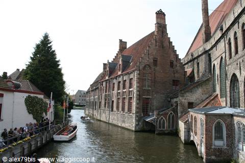 Bruges canal beside the medieval Saint John's Hospital brick building