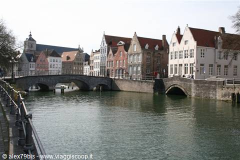 Stone bridges and stepped-gable houses along a Bruges canal