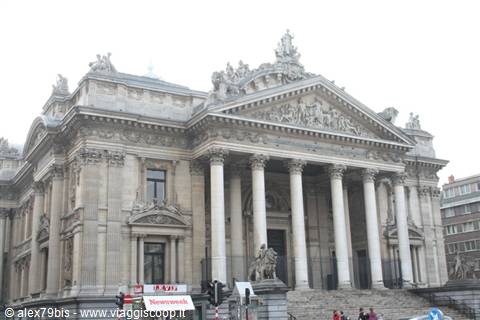 Neoclassical facade of the Brussels Stock Exchange, Corinthian columns, sculptures, gray sky