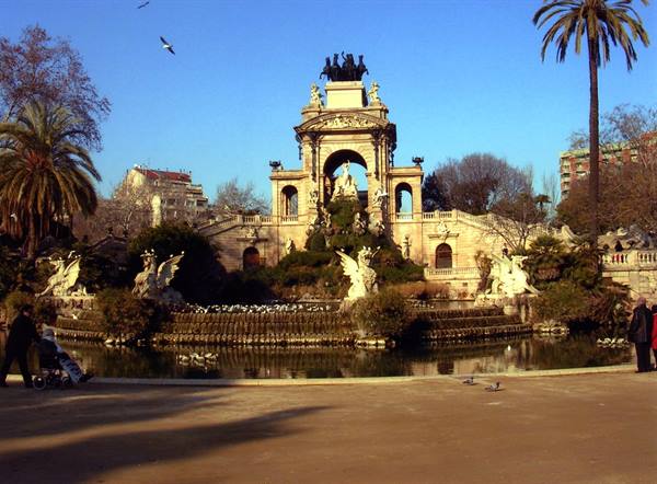 Monumental fountain in Parc de la Ciutadella, Barcelona, stone sculpture, people strolling
