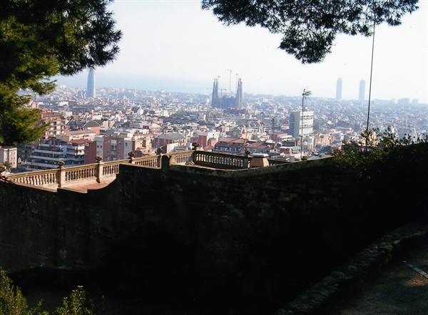 Stone terrace over Barcelona, with the Sagrada Familia among the buildings