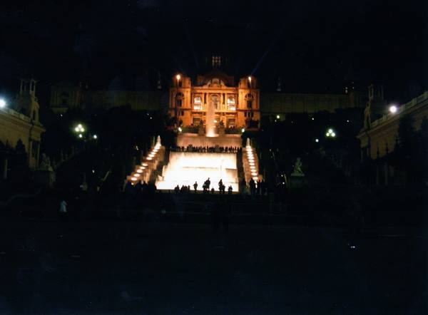 Spanish Steps at night: crowd on illuminated staircase before Trinità dei Monti church