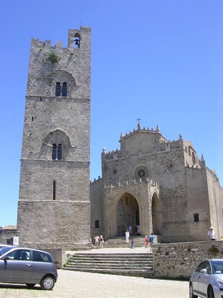 Erice cathedral with Norman stone tower, tourists on steps, blue sky