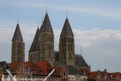 The five towers of Tournai Cathedral rising above red rooftops