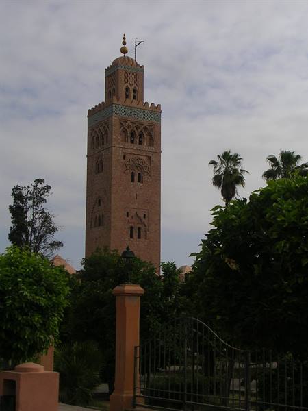 The Koutoubia minaret in Marrakech rises among palm trees and green gardens