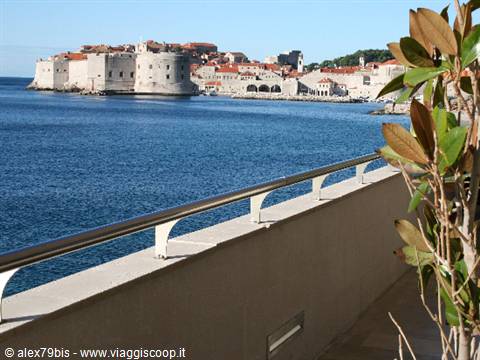 Balcony railing and plant overlooking Dubrovnik's old walls on the Adriatic
