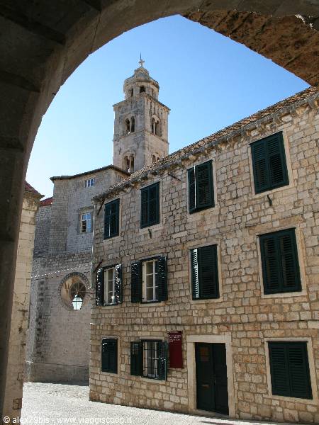Stone bell tower seen through an archway, Korčula