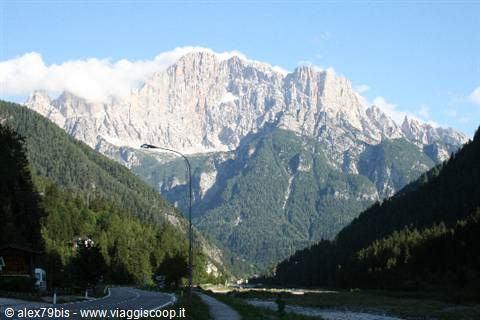 Civetta massif towering above the road and valley forests