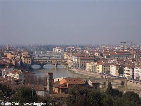 Ponte Vecchio over the Arno among Florence rooftops in the haze