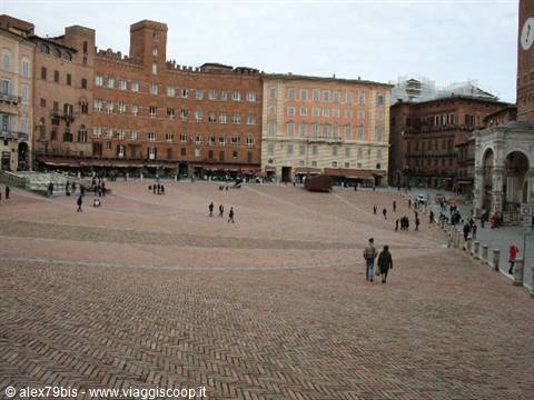 Piazza del Campo in Siena, brick pavement, historic buildings and a few walkers