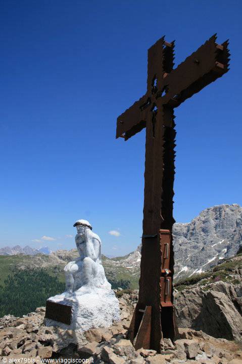 Marble statue and iron cross on Monte Piana summit