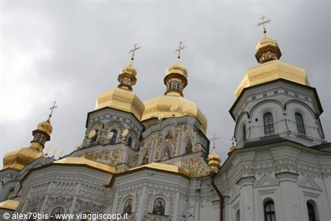  Golden domes of Kyiv Lavra cathedral against a grey cloudy sky