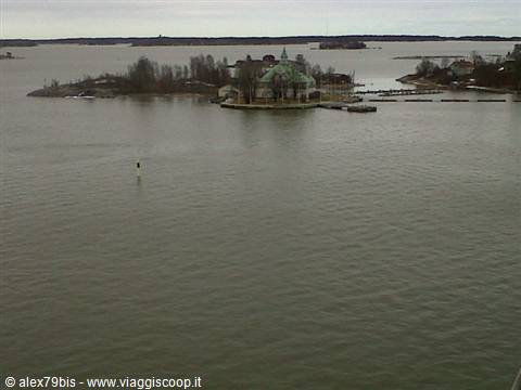 Small islet with green-roofed pavilion in grey bay, Helsinki archipelago