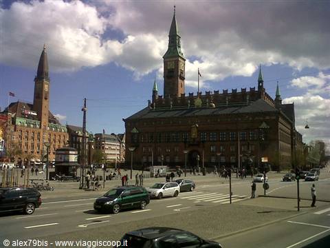 Copenhagen City Hall, red brick building with clock tower, traffic crossing the square
