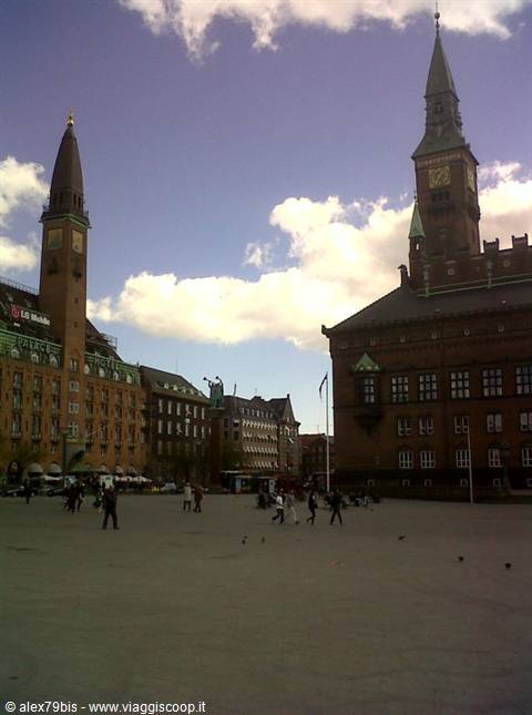 Copenhagen City Hall square, red brick building under white clouds