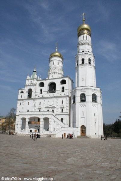 Ivan the Great Bell Tower with white belfry under golden domes in Kremlin square