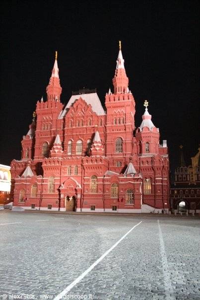 The red History Museum lit up at night on Red Square, Moscow