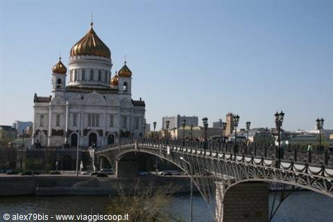 Cathedral of Christ the Saviour with golden domes beside pedestrian bridge over Moskva
