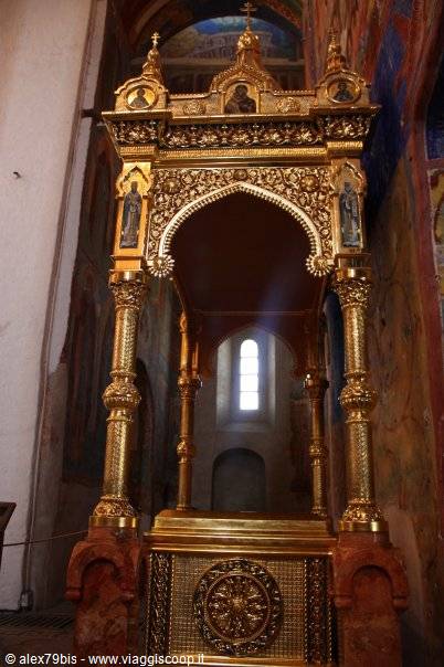 Gilded carved canopy with painted saints inside an Orthodox church