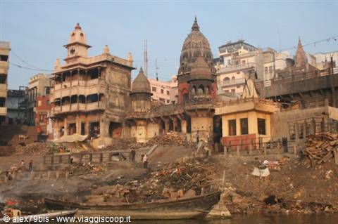 Varanasi: wooden boats along the ghat beneath ancient temples