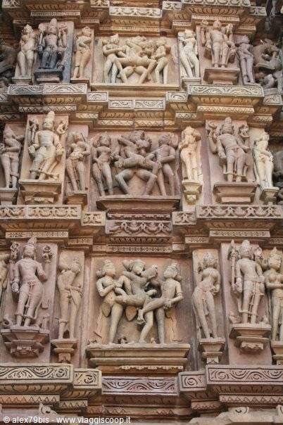 Sandstone carvings of deities and erotic figures on Khajuraho temple wall