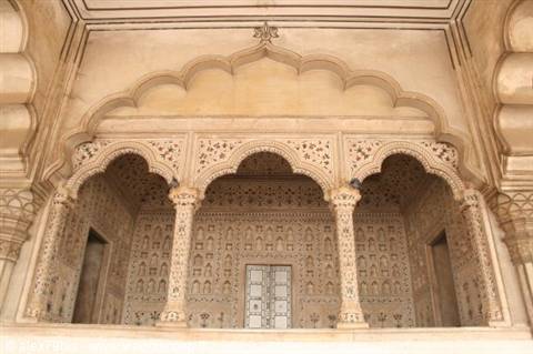 Marble pavilion with scalloped arches, carved columns and floral inlays