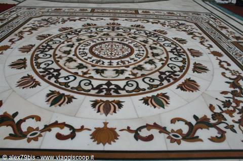 White marble floor with colorful floral pietra dura inlays