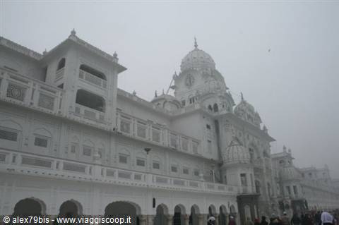 Golden Temple in Amritsar shrouded in fog, white marble domes