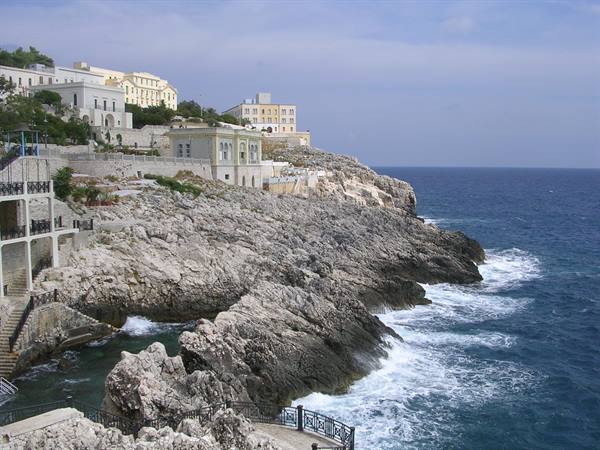 Santa Cesarea Terme: historic buildings on limestone cliffs beaten by waves