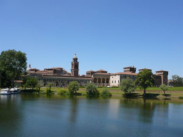 Ducal Palace in Mantua seen from the lake, sunny morning
