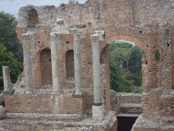 Marble columns and brick walls of the ancient Taormina theatre