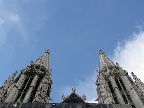 The Gothic spires of Vienna's Votivkirche against the blue sky