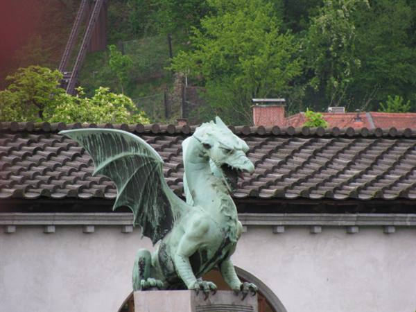Oxidized green bronze dragon statue on the Dragon Bridge, Ljubljana
