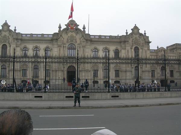 Government Palace of Lima, guards by the iron fence under flag