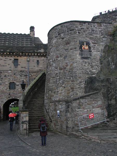 Tourist near the stone staircase of Edinburgh Castle