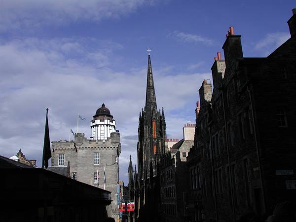 Gothic spire and dark stone buildings on the Royal Mile, Edinburgh