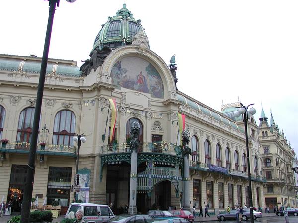 Prague's Municipal House, Art Nouveau facade with green dome and central mosaic