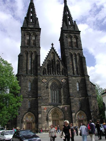 Tourists walk past the neo-Gothic Basilica of St Peter and St Paul, Vyšehrad