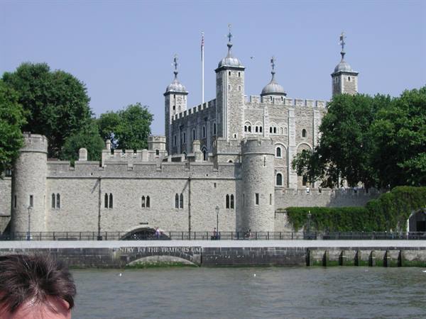 Tower of London, stone walls along the Thames in daylight